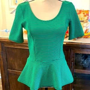 Flattering green top with black pin stripes. “Skirt” bottom is 👌🏽